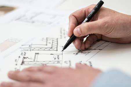 Man drafting layout of rental investment home