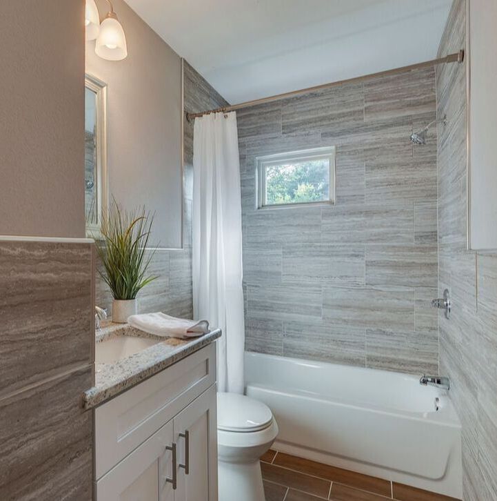 Beautiful clean line bathroom staged by Prime Home Staging with natural light streaming through the window. Picture